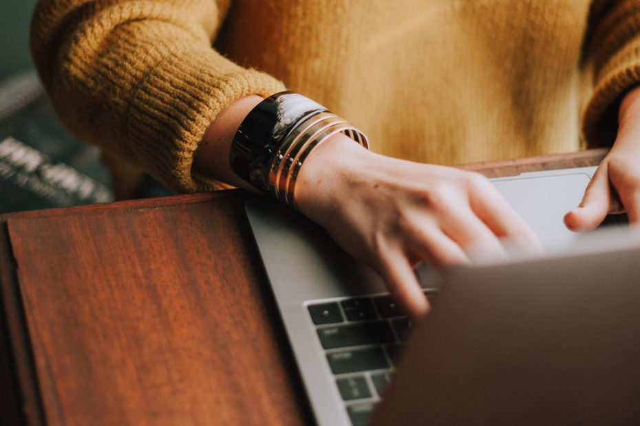 A woman working at a laptop