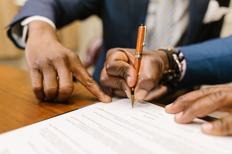 Man signing papers